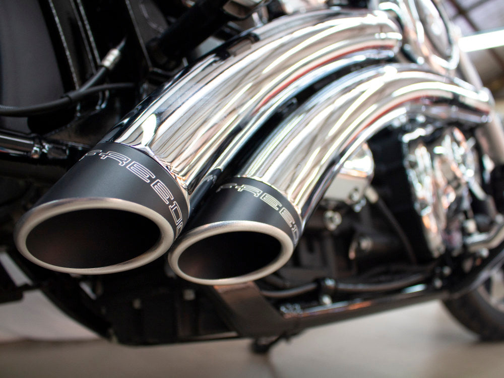 Radical Radius Exhaust – Chrome with Black End Caps. Fits Softail 2018up – Freedom Performance Exhaust